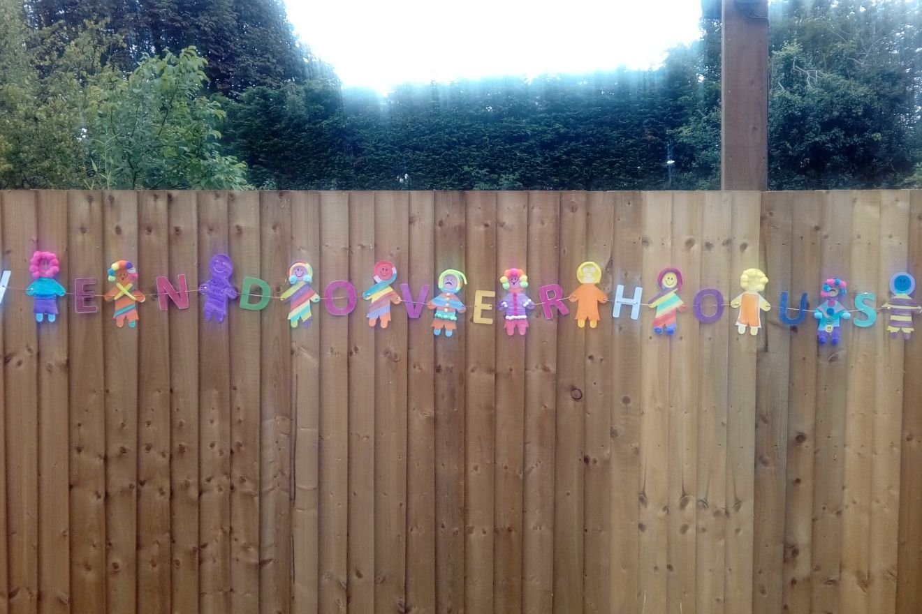 Garden fence with colourful banner