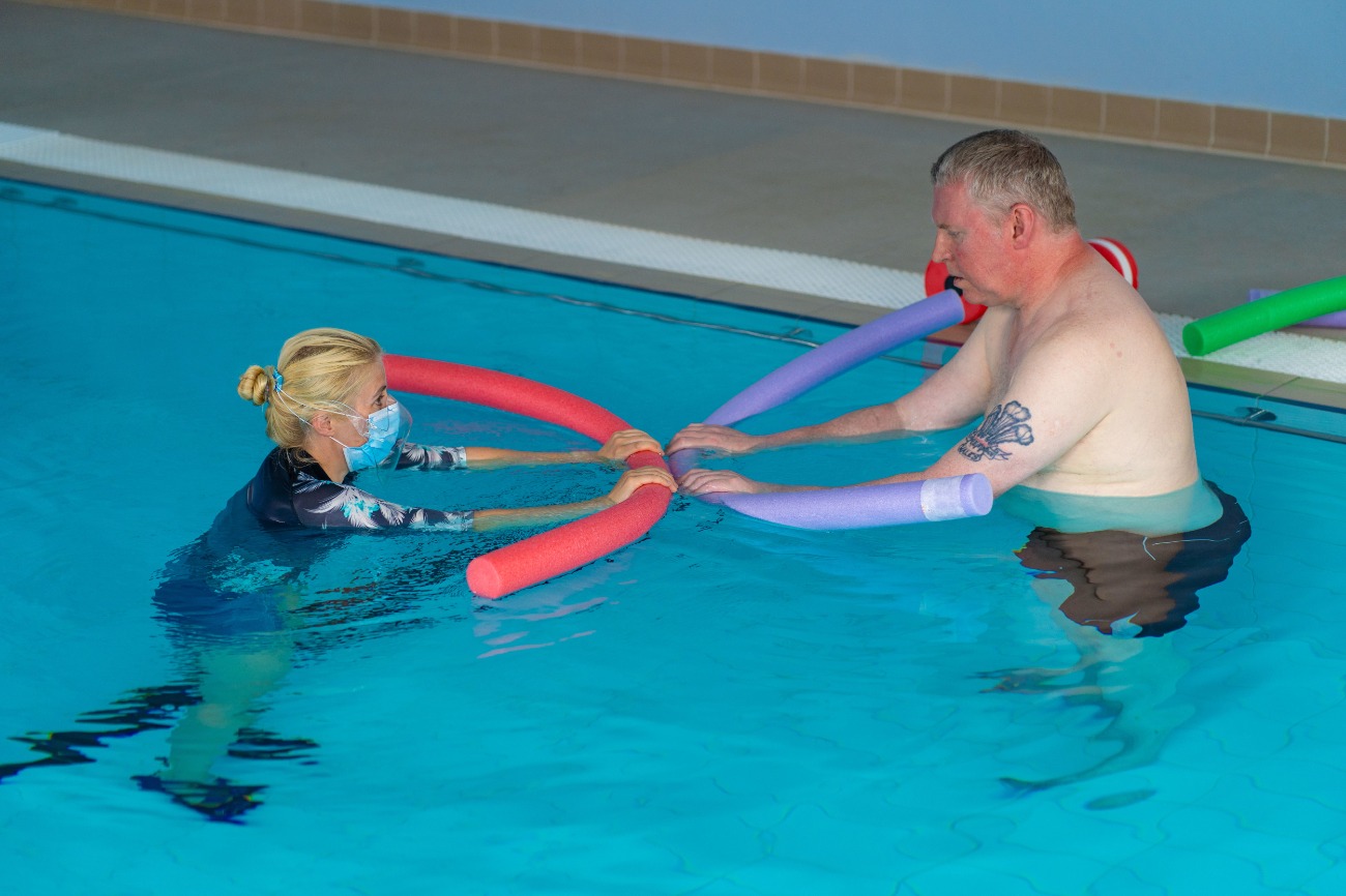 Two people swimming